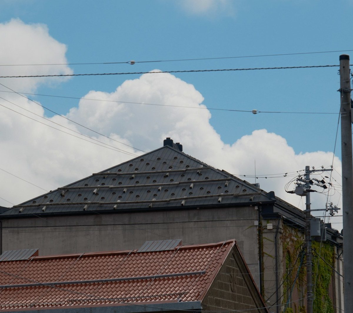 a view of a building with a sky background