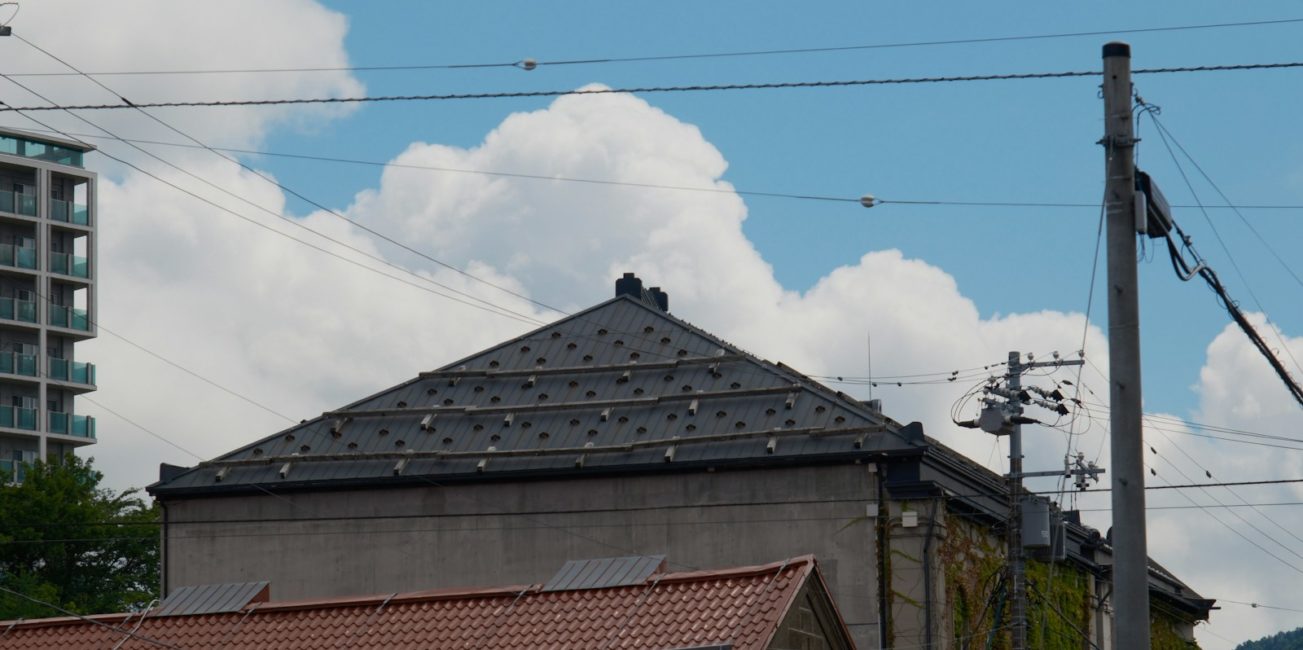 a view of a building with a sky background